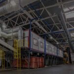 The inside of a factory with a lot of equipment.
