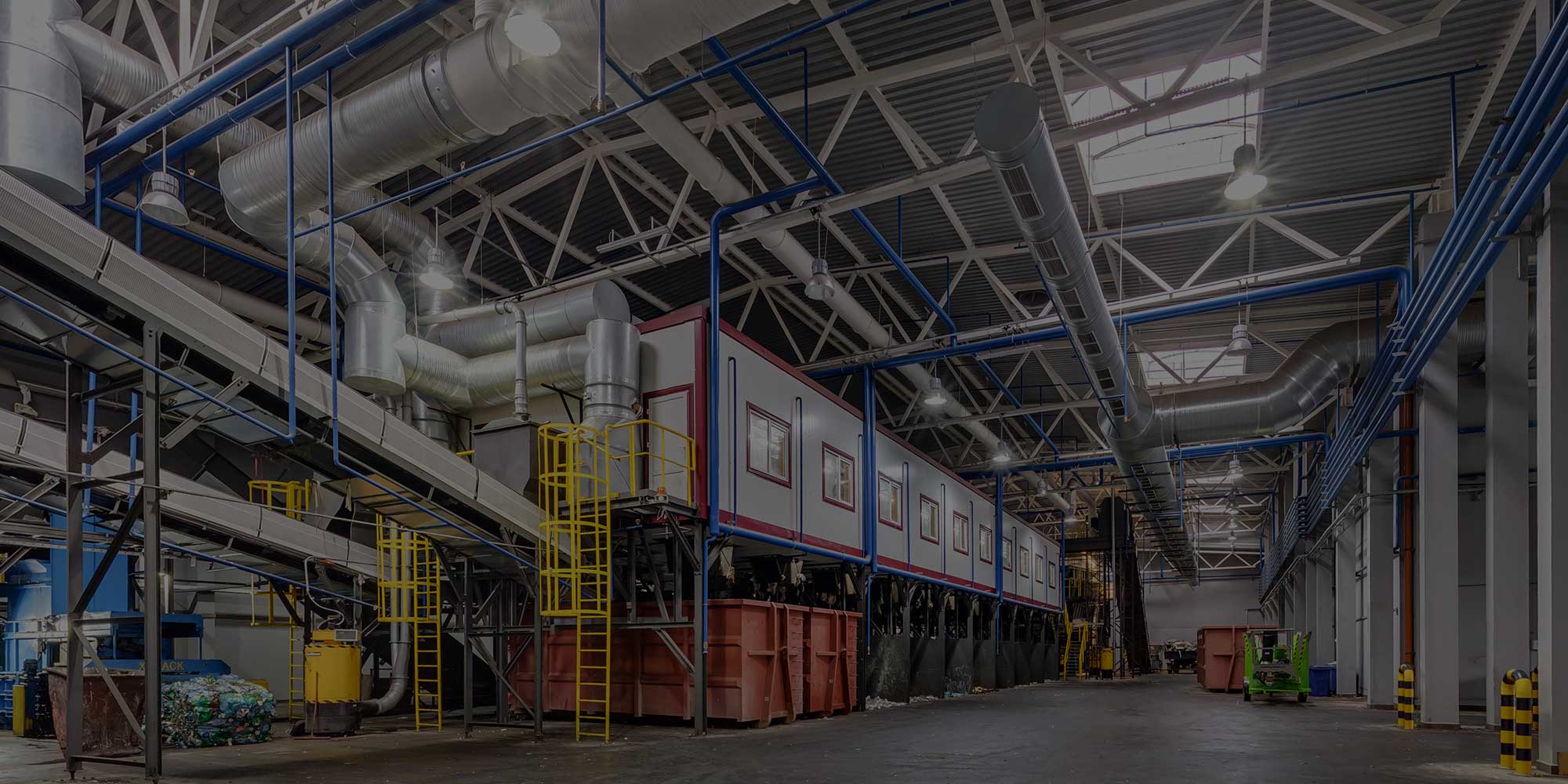 The inside of a factory with a lot of equipment.