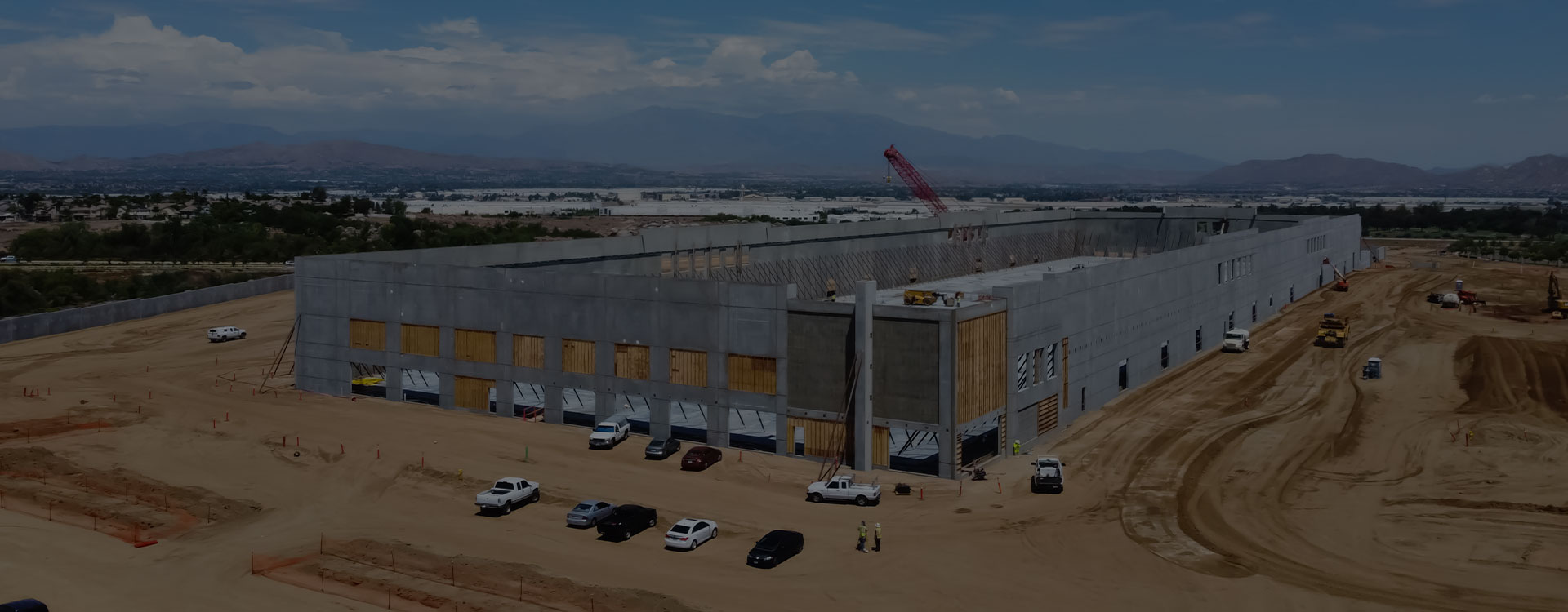 An aerial view of a large warehouse in the desert.