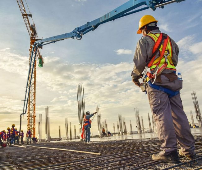 A group of construction workers on a construction site.