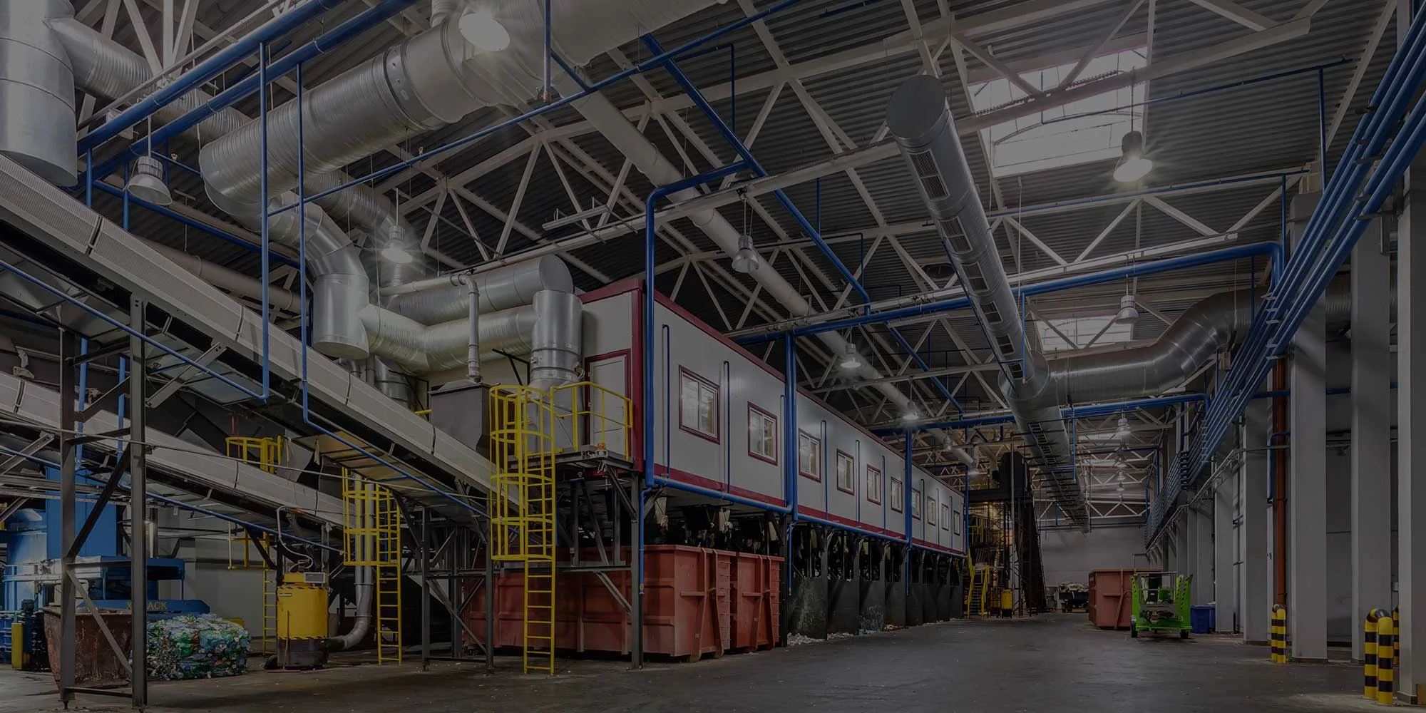 The inside of a factory with a lot of equipment.