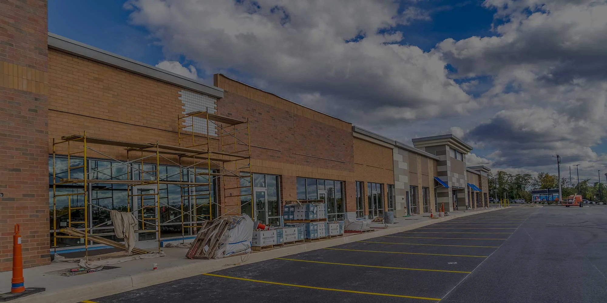 The exterior of a shopping center under construction.